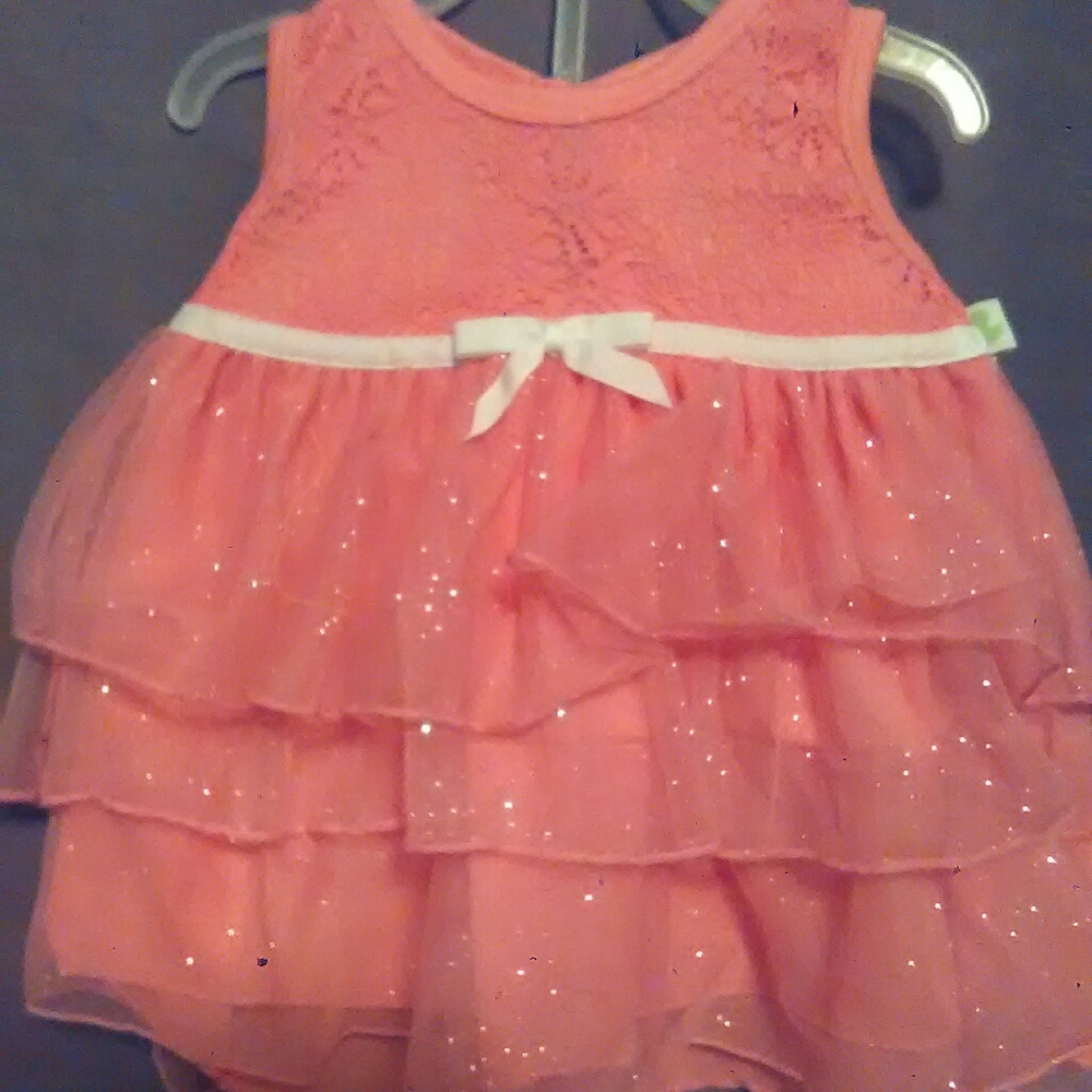 Dress outfit more of a coral pink color